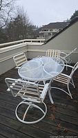 Full patio set showing table, four chairs, lounge recliner
