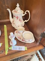 Coffee pot, creamer, sugar bowl with lid on oval tray and salt & pepper shakers