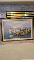 Full view of framed signed seascape oil painting