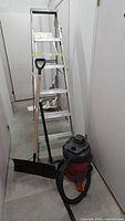 Group view of ladder, snow shovel and Shop-Vac