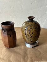 Both vases side by side showing overall shapes and glazes