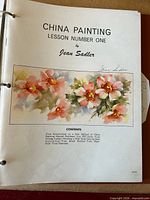 Cover page of Lesson Number One showing floral watercolor illustration and Jean Sadler signature