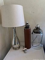 All three lamp bases shown together on surface