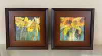 Two framed square watercolor flower paintings in wood frames