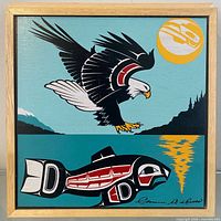 Full view of cedar box framed artwork showing eagle and salmon design