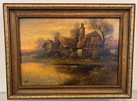Full view of framed painting showing cottages, pond and sunset