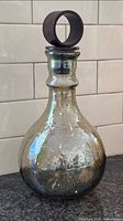 full view of hammered glass decanter front