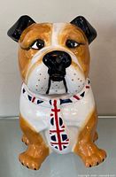 Front view of ceramic bulldog cookie jar showing facial features and Union Jack scarf
