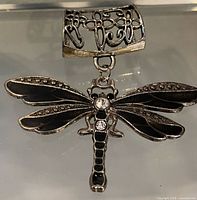 Front view showing dragonfly brooch and scarf ring
