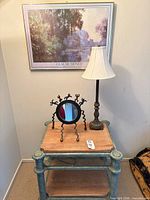 Accent table with mirror and lamp shown together