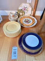 Group shot of assorted stacks of plates and teacup