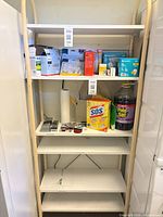 Full view of shelving unit showing frame color, shelf count, and overall appearance