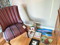 Chair, greeting cards, paintings, magazines overview