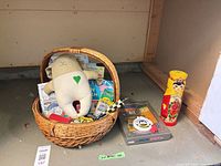 Overall view of basket with plush, books, toys, memory kit and matryoshka doll