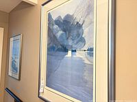 Framed print with blue landscape (likely "Kano Inlet"), silver frame, double mats