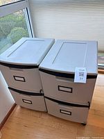 Both Storex cabinets side by side showing two-drawer configuration and casters