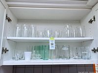 Cabinet showing all glassware on two shelves