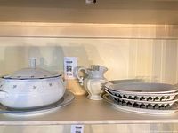 Complete set on shelf: tureen, pitcher, three platters
