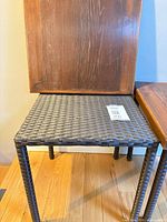 Table base with wood top removed showing wicker weave