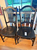 Front view of both chairs showing design and finish