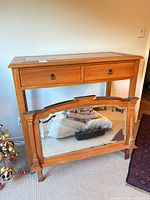 Overall view of console table with detached mirror leaning beneath