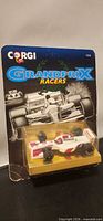 Front view of sealed Corgi GrandPrix Racers Footwork FA13 #9 on blister card