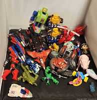 All toys spread on black surface to show variety