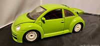 Left side view of lime green 1/24 Volkswagen New Beetle model