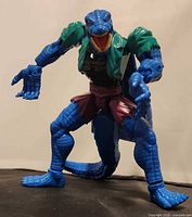 Front view of blue Lizard action figure standing