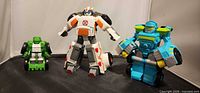 Front view of all three Rescue Bots figures standing