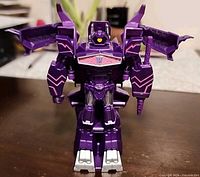 Front view of Shockwave robot mode standing upright showing chest emblem and limb details