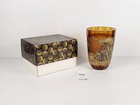 Vase beside patterned box, overall view