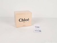 Front of sealed Chloé Eau de Parfum box beside lot tag