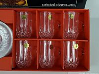 Box interior showing six crystal cups with stickers