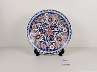 Full view of decorative plate on stand