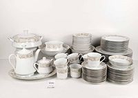Full 96-piece set arranged showing dinnerware and serving pieces