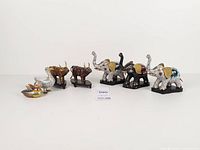 All seven cloisonné animal figurines displayed