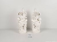 Front view of both Blanc de Chine Guanyin figurines