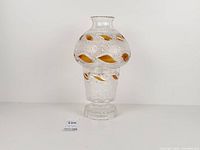 Full view of two-piece cut crystal and amber candle holder