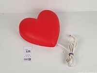 Full view of red heart lamp with cord