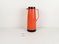full view of orange and black King-Seeley Super Quart thermos standing upright