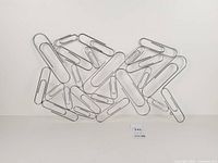 Full view of chrome paperclip wall sculpture