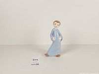 front view of porcelain boy figurine