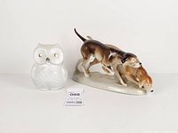 Both figurines side by side on white background