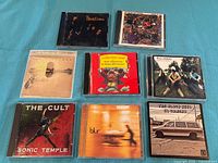 Group shot of all eight CDs in jewel cases