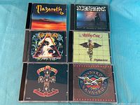 Front covers of all six rock CDs arranged in two rows