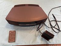 Top view of Bose Wave Music System with remote and Bluetooth adapter