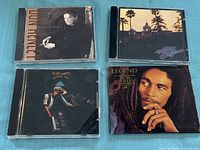 Four CD fronts showing album artwork