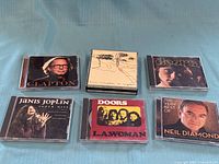 Front view of six CD cases showing album artwork