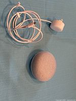 Google Home Mini with power cable and adapter on table